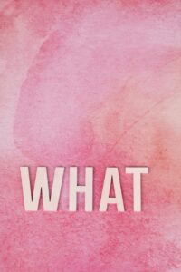 Pink watercolor background with 'What' text. Perfect for creative projects needing a modern touch.